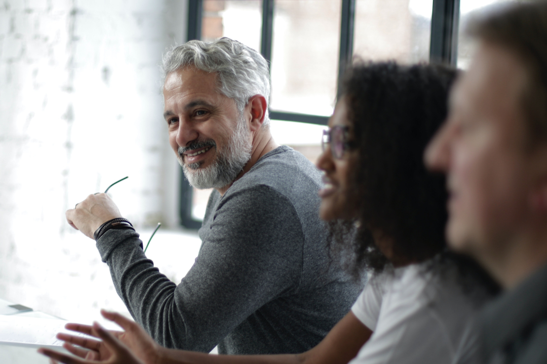 Man smiling in meeting